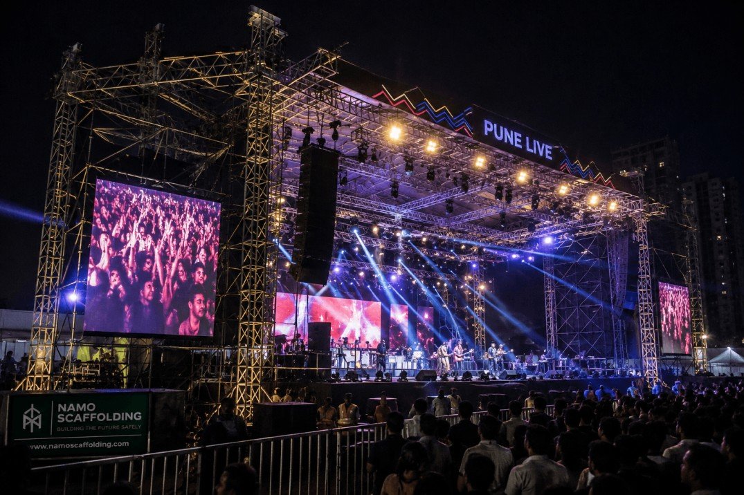 Event scaffolding stage structure set up for a large public function in Pune